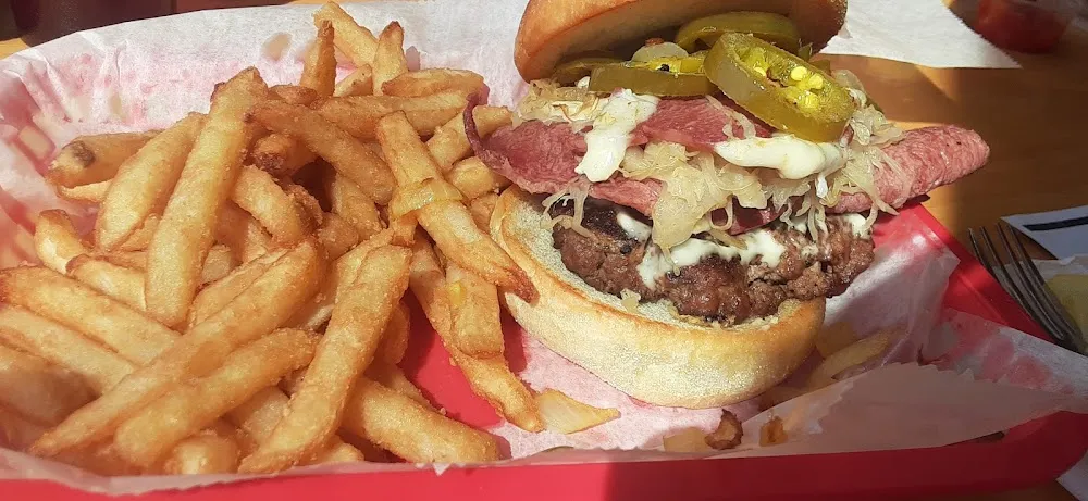 Reuban Burger and Fries Added Jalapeno and Onions